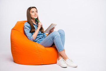 Full size profile side photo of focused girl sit on lounge chair think want create fiction story...