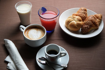 Breakfast with espresso, cappuccino and croissantin