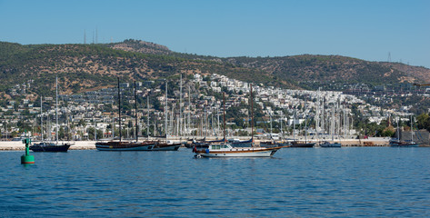 Boats and yachts in the harbor of Bodrum in the land of Turkey