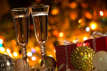 Champagne glasses and Christmas balls and Christmas gifts