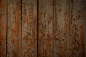 Dark brown wooden boards with a worn surface. Old wooden background texture with vertical pattern.