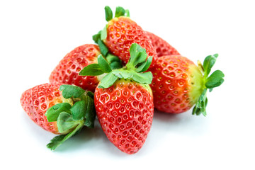 pile of strawberries on a white background
