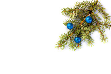 New Year decoration, postcard. Fir branch, blue balls on a white background. Isolated. Place for text