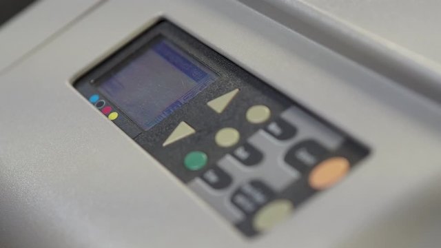 Static shot of Wide format printer, plotter is printing design draft outline sketch drawing in the printing house. Design office supply equipment.