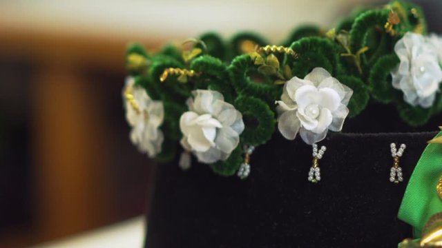 Flower pattern on a hat and a golden crown as accessories in the Sorbian culture and tradition.