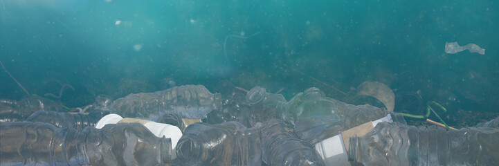 plastic pollution in ocean water, bottles and bags on the sea floor, micro plastic pollution