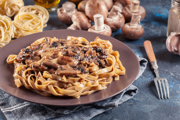 Tagliatelle pasta with champignion mushrooms