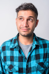 Obraz premium Face of young Persian hipster man thinking