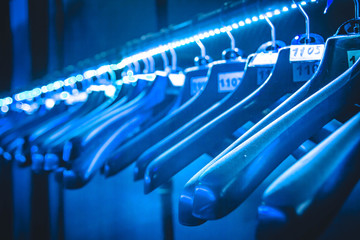 hangers hangers for clothes illuminated with neon tape hanging in a row