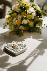Wedding rings with decorations on wedding day preparations