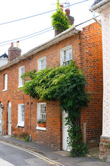 view of a countryside street with a close-up of traditional British little house