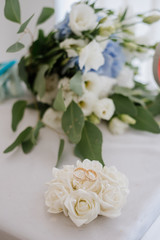 Wedding rings with decorations on wedding day preparations