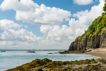 Hiking in Brittany, France on a beautiful summer day. A coastal path around the "Pointe De Meinga" leads from one beach to anoter and is located near the villages of  La Guimorait and La Marette.