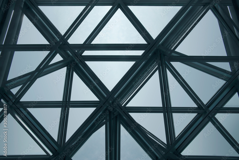 Poster modern architecture fragment with structural glazing. backlit glass ceiling, roof or wall consisting