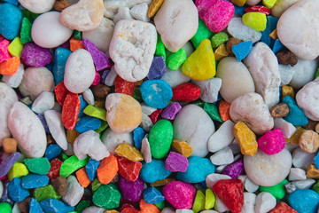 background of colorful, polished, semiprecious stone on grained wood