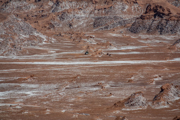 Long shot of abandoned bus in Atacama desert