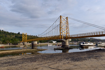 The yellow bridge sets as a connection point between Lembongan Island and Nusa Ceningan Islands, Indonesia