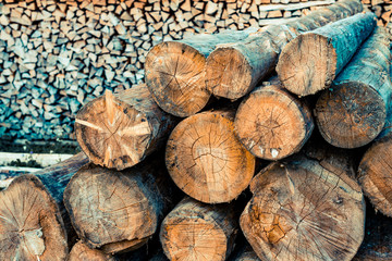 Stacked wood logs for cutting and chopping