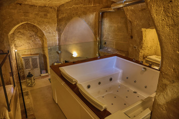 Hotel style decor of stone of Matera, color that warms the heart