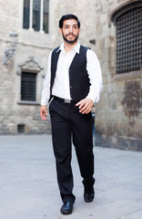 Man walking along old town street