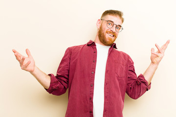 young red head man shrugging with a dumb, crazy, confused, puzzled expression, feeling annoyed and...