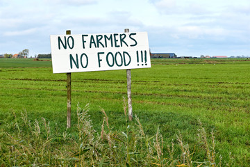 Sign in agricultural field with text No Farmers No Food. Farmers in the Netherlands protesting...