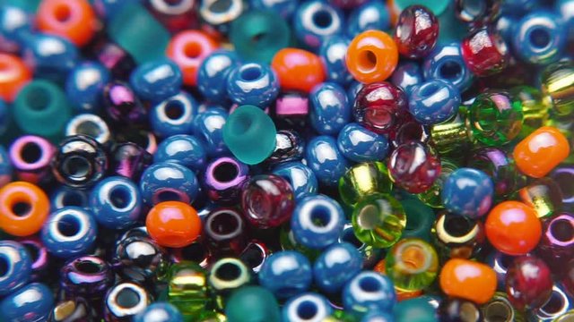 Of the movement of colored jewelry beads