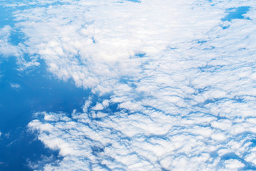 Blue sky background with white clouds,view from the window of airplane, beautiful cloudscape for relaxing technique therapy,suitable for all types of designs, travelling concept