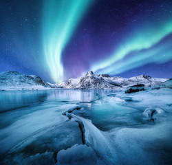 Aurora Borealis, Lofoten islands, Norway. Nothen light, mountains and frozen ocean. Winter...