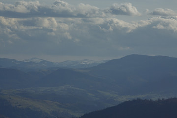Fototapeta na wymiar Panorama of beautiful mountains. It smells like spring in the street
