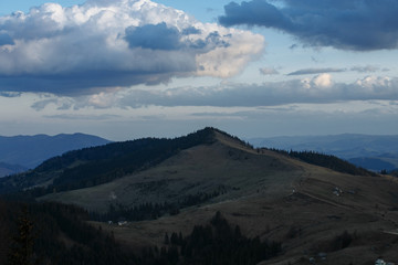 snow-capped peaks of the mountains. clouds walking in the evenings over the mountains