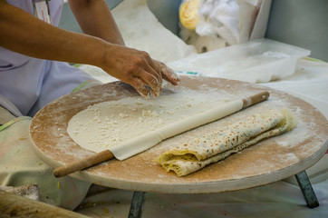 woman bakes bread with cheese