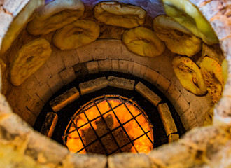 Puri Tandoor oven bread making in a bakery of Ninotsminda Samtskhe Javakheti region Georgia eastern...