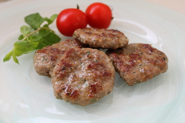 meatballs with vegetables on white plate