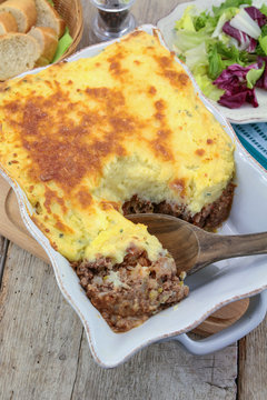 dish of minced meat pie on a wooden table