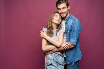 Happy loving couple isolated isolated on pink background.