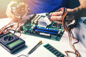 technician installing computer hardware components