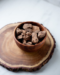Chocolate chunks on a marble background.