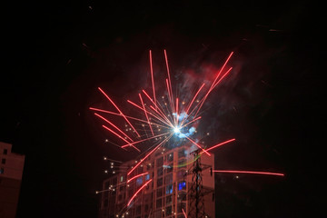 Obraz premium Fireworks over buildings