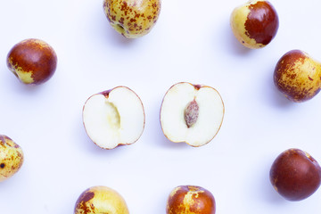 Chinese jujubes on white background.