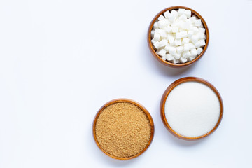 Wooden bowl with sugar on white background. Copy space