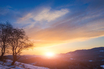 Fototapeta na wymiar cold morning. beautiful landscape of snow-covered mountains. Magic winter sunrise on a peak of hill