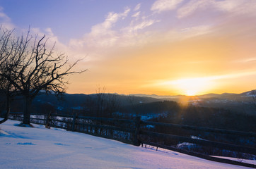 cold morning. beautiful landscape of snow-covered mountains. Magic winter sunrise on a peak of hill