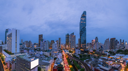 Bangkok business district cityscape with skyscraper at twilight, Thailand