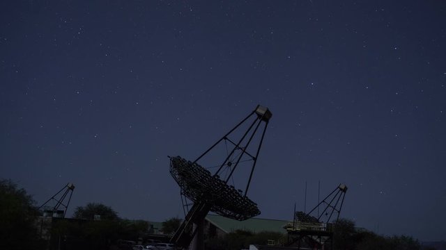 Time lapse of large dish telescopes tracking objects in deep space