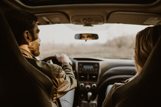 Beautiful Couple Doing A Car Trip On Countryroad.