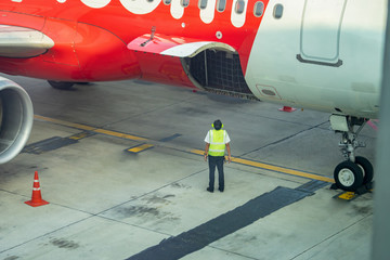 Aircraft Maintenance Engineer ,Airplane Technician, They Diagnose Jet Engine Through Open Hatch.