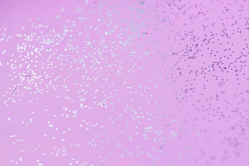 pink festive glitter background selective focus