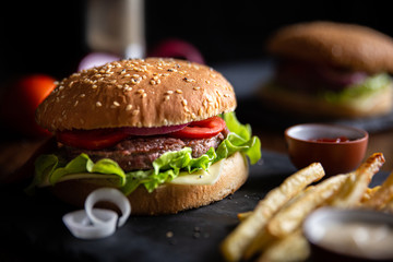 classic burger with fries, close-up shot