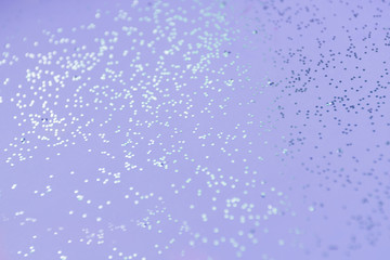 Violet glitter selective focus background
